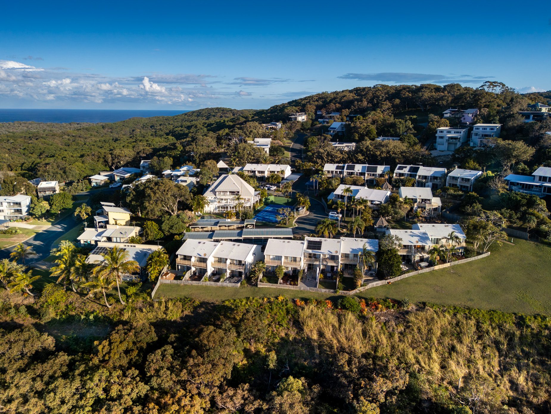 Pandanus Palms Resort set among coastal bushland above the ocean at Point Lookout