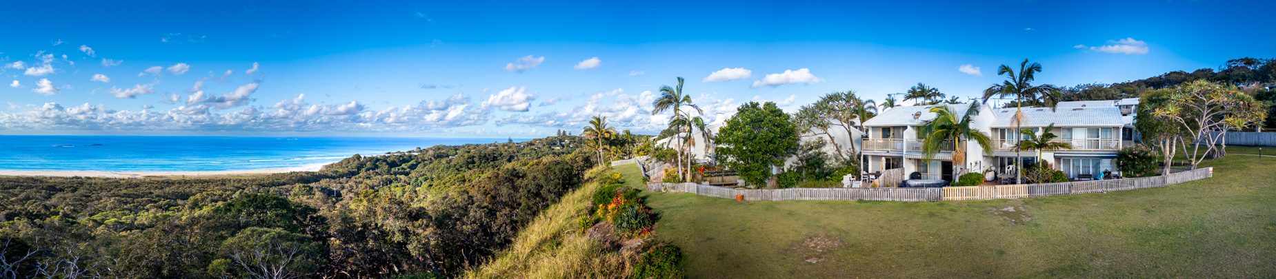 The open grassed headland reserve beside Pandanus Palms Resort, looking out over the ocean