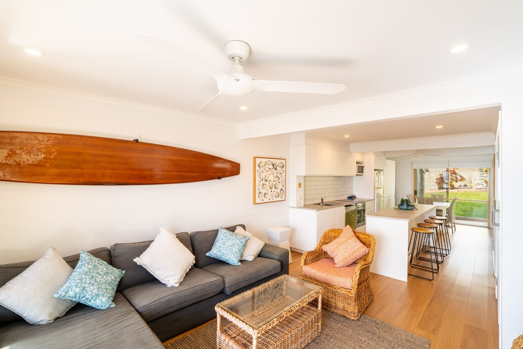Open plan living room and kitchen inside a Premium Headland Ocean villa at Pandanus Palms Resort