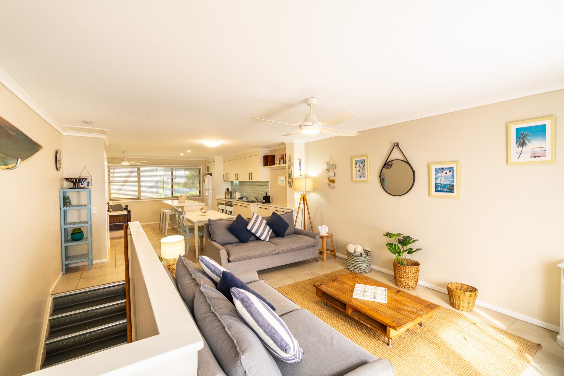 Open plan living room and kitchen inside a Deluxe Ocean villa at Pandanus Palms Resort