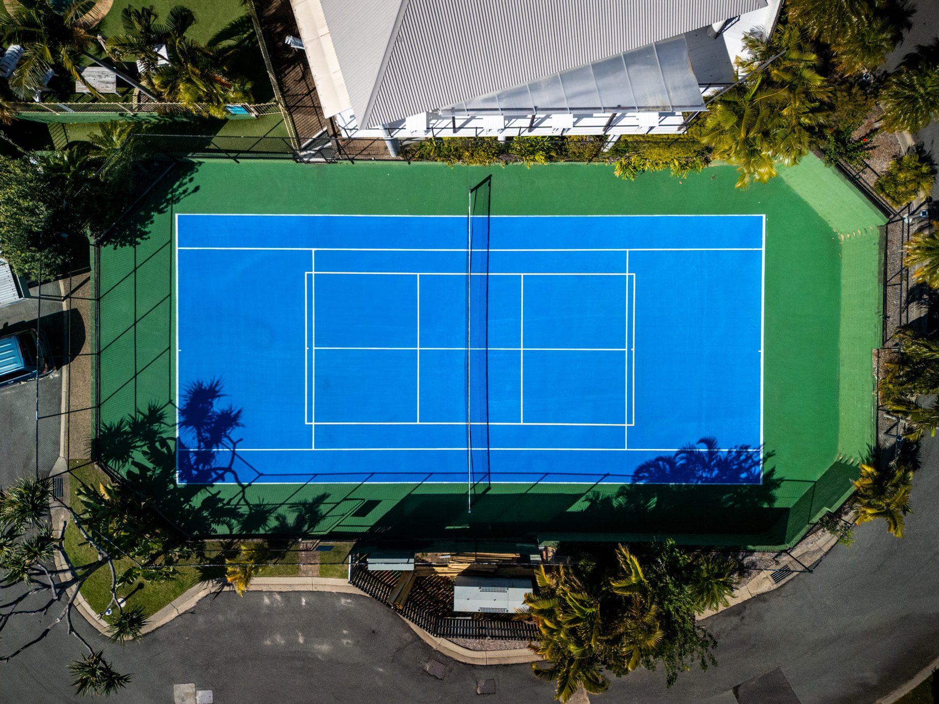 Looking straight down on the tennis and pickle ball court at Pandanus Palms Resort