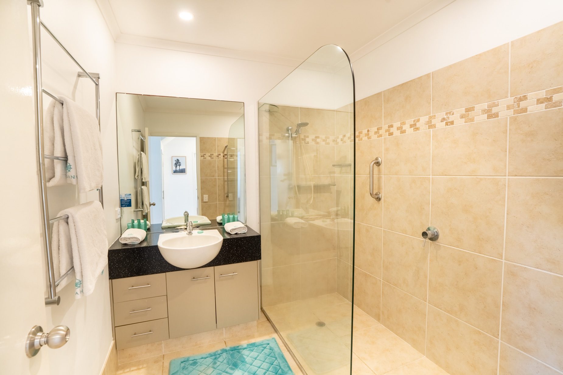 The bathroom with a walk-in shower in the Standard Headland Ocean 3 Bedroom villa