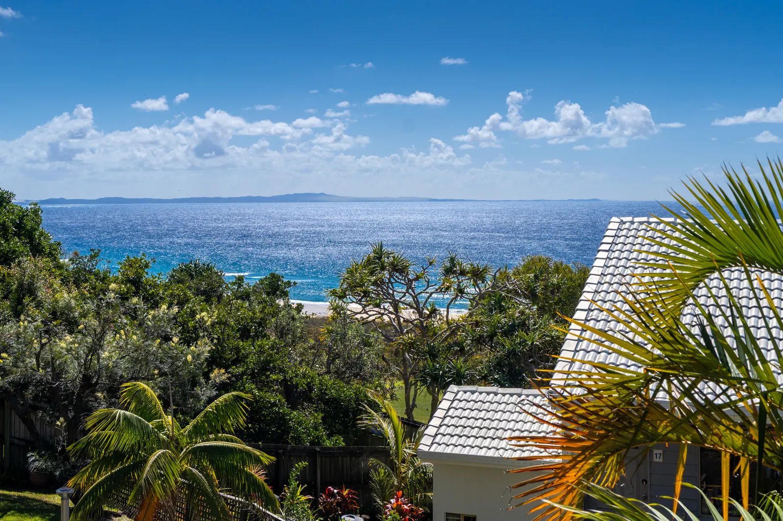 Ocean views over the treetops from a Deluxe Ocean villa at Pandanus Palms Resort