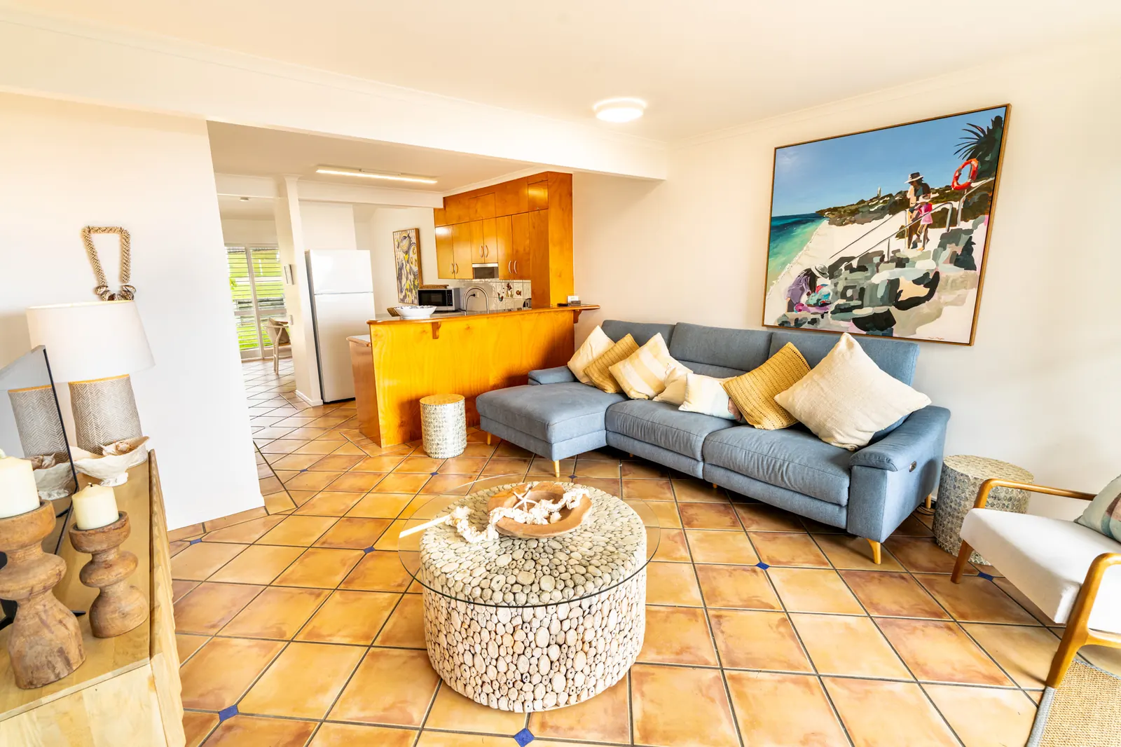 Open plan living room and kitchen inside a Premium Headland Ocean villa at Pandanus Palms Resort