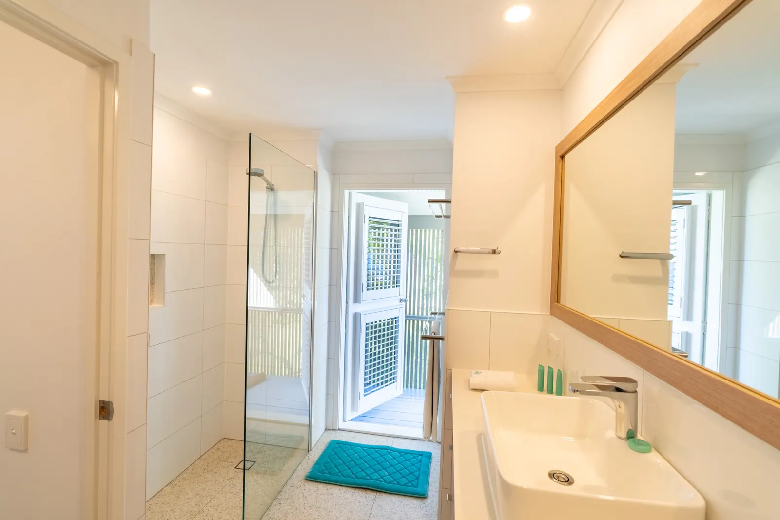 The bathroom inside a Prestige Headland Ocean 3 Bedroom villa at Pandanus Palms Resort