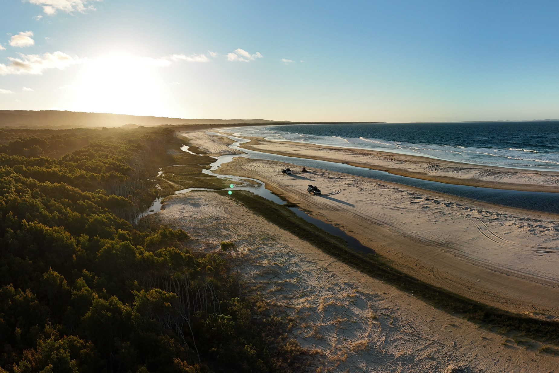 Four wheel drives parked on Flinders Beach at sunset